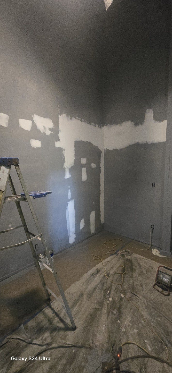 Drywall repair and preparation before painting